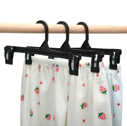 Umeraș pentru fuste din plastic negru cu clipsuri - ideal pentru pantaloni și fuste - HUMERO